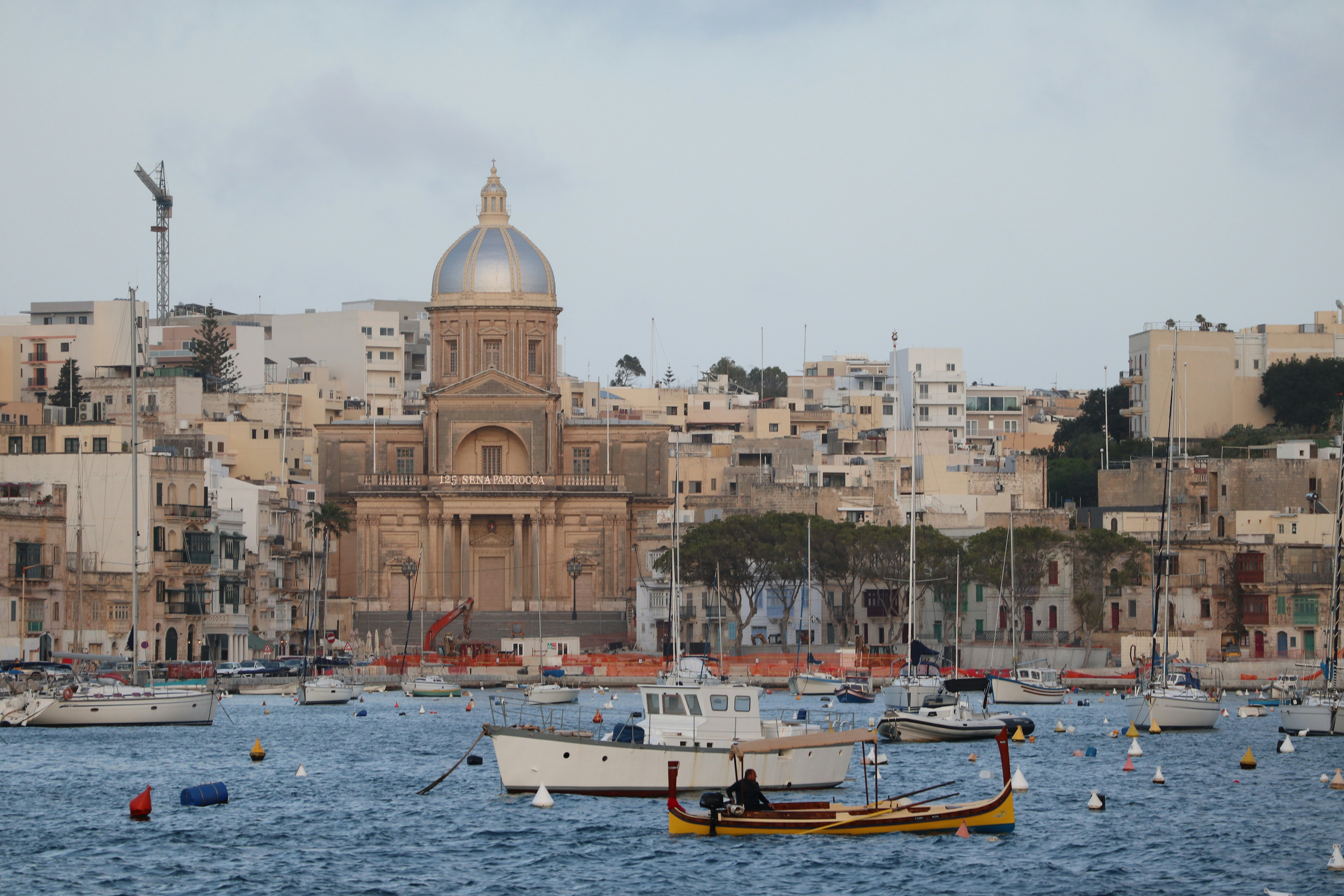 Traditional dgħajsa harbour boat crossing from Bormla to Valletta, Malta