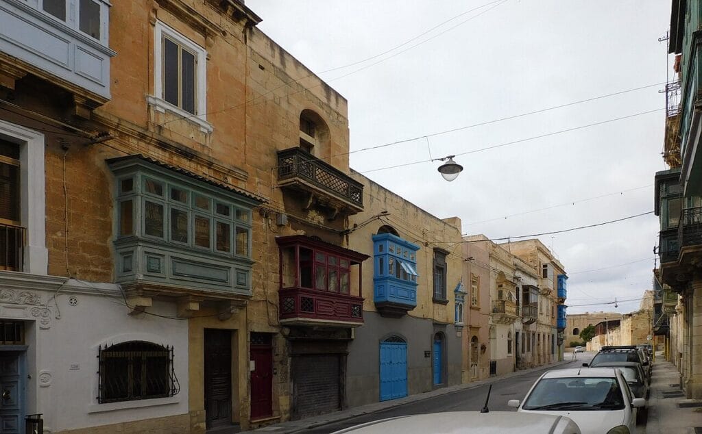 Traditional limestone street in Bormla with enclosed balconies