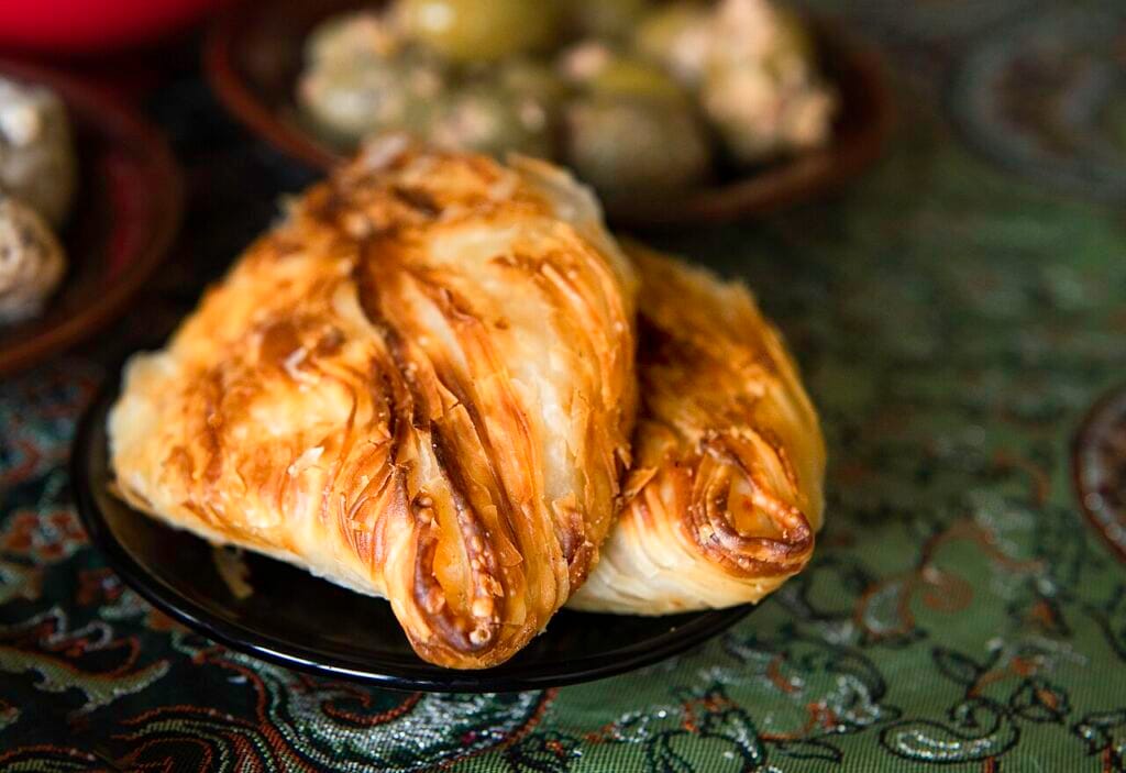 Traditional Maltese pastizzi — flaky ricotta and pea pastries